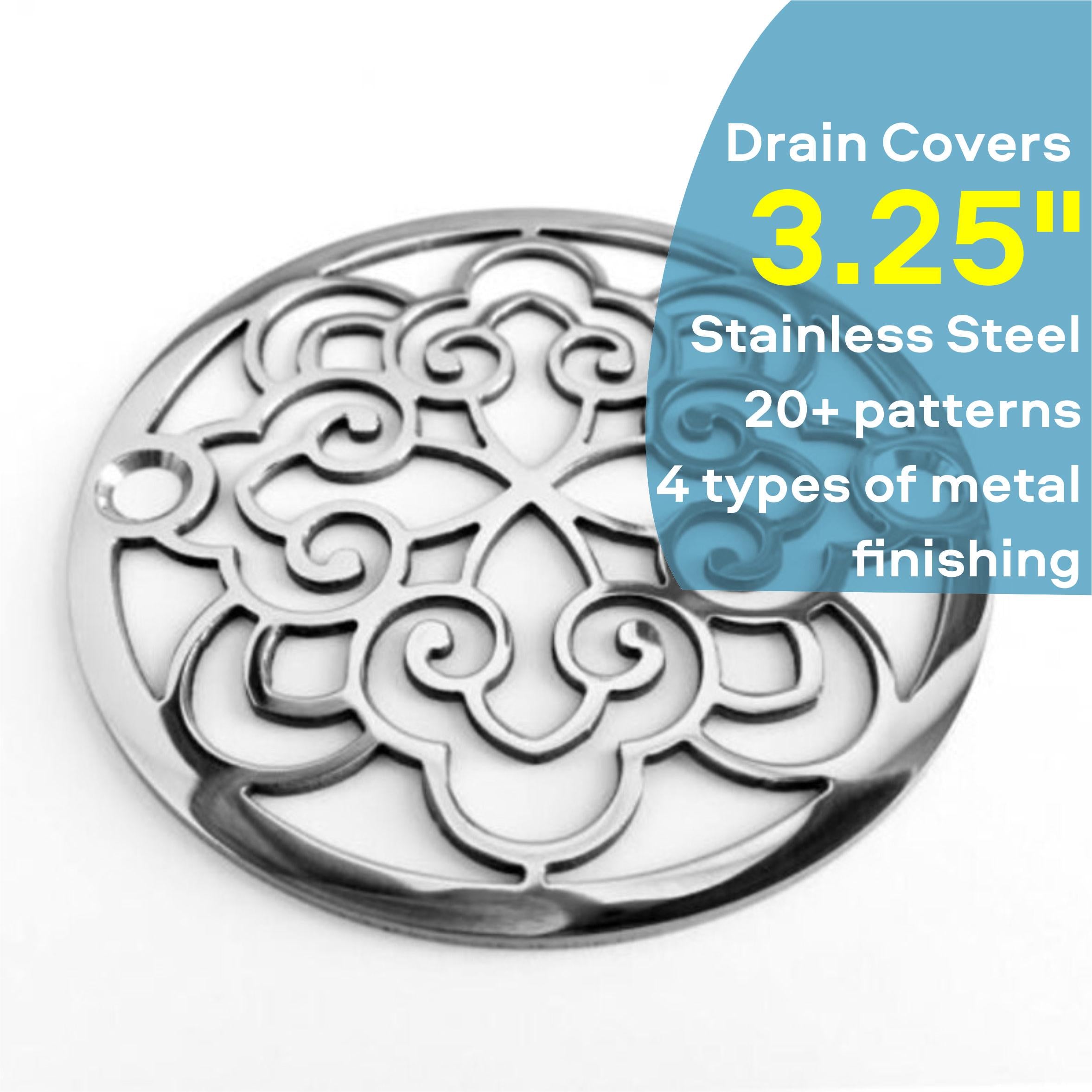 Decorative stainless steel drain cover with intricate patterns on a white background