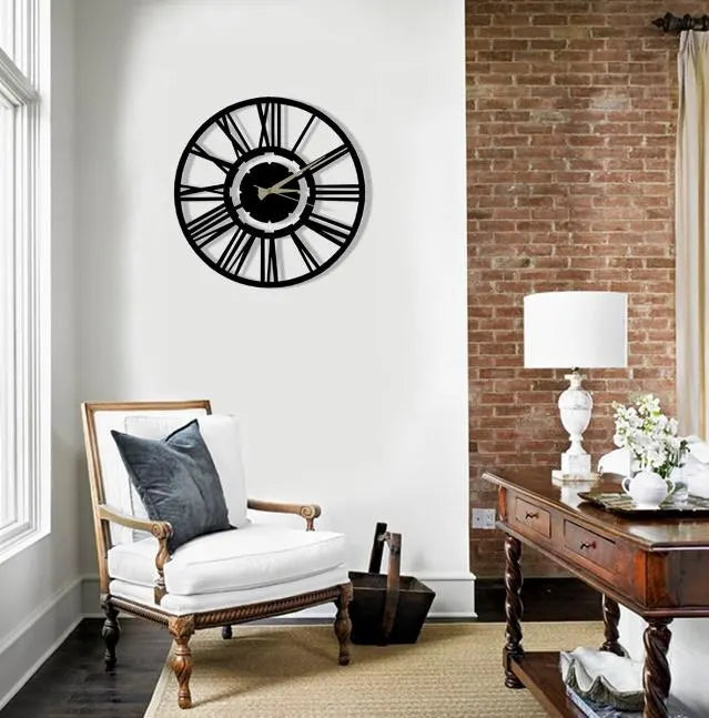 Living room with a large wall clock, white armchair, and wooden table.