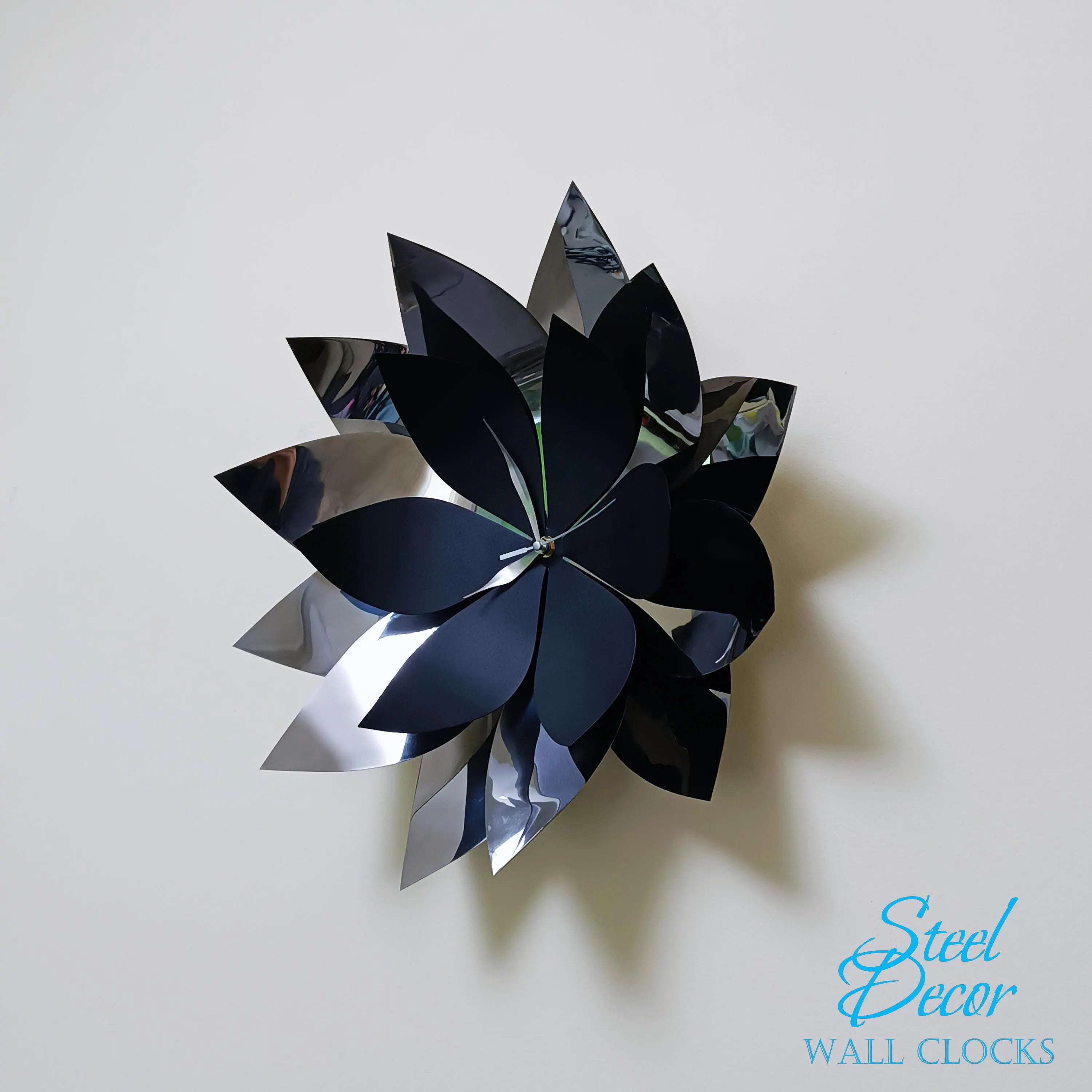 Decorative wall clock with flower-like design on a plain background, branded 'Steel Decor'.