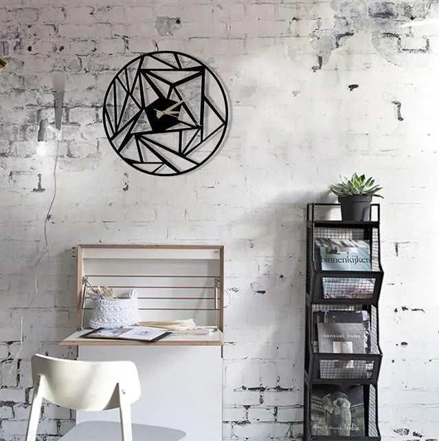 Modern interior with geometric wall art, desk, chair, and bookshelf against a white brick wall.